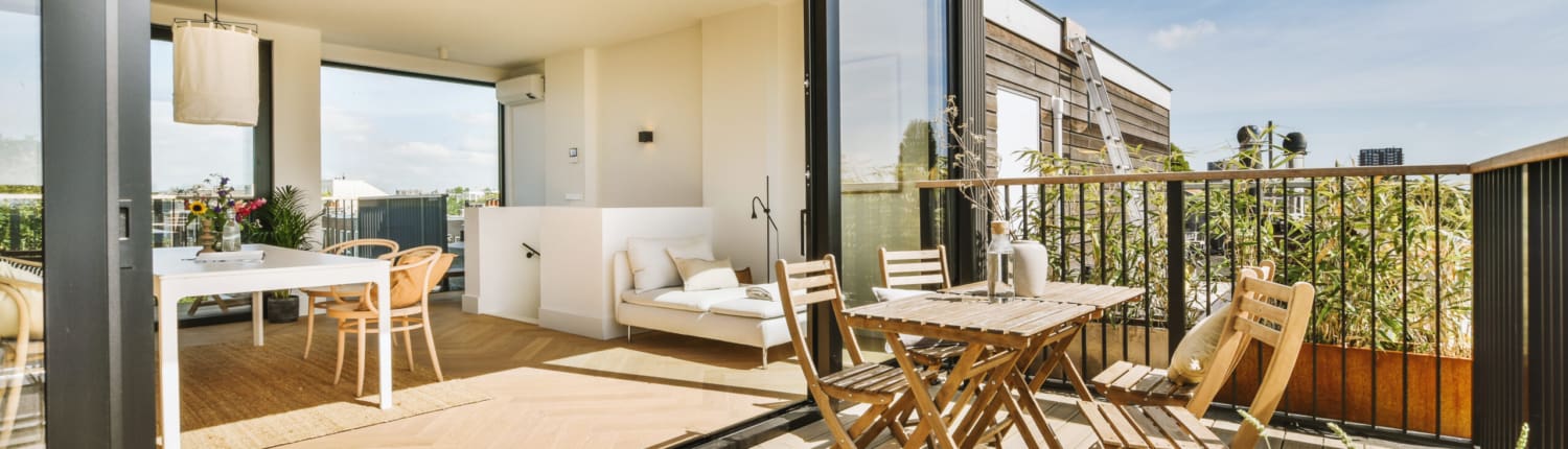 Bright balcony with chair and door